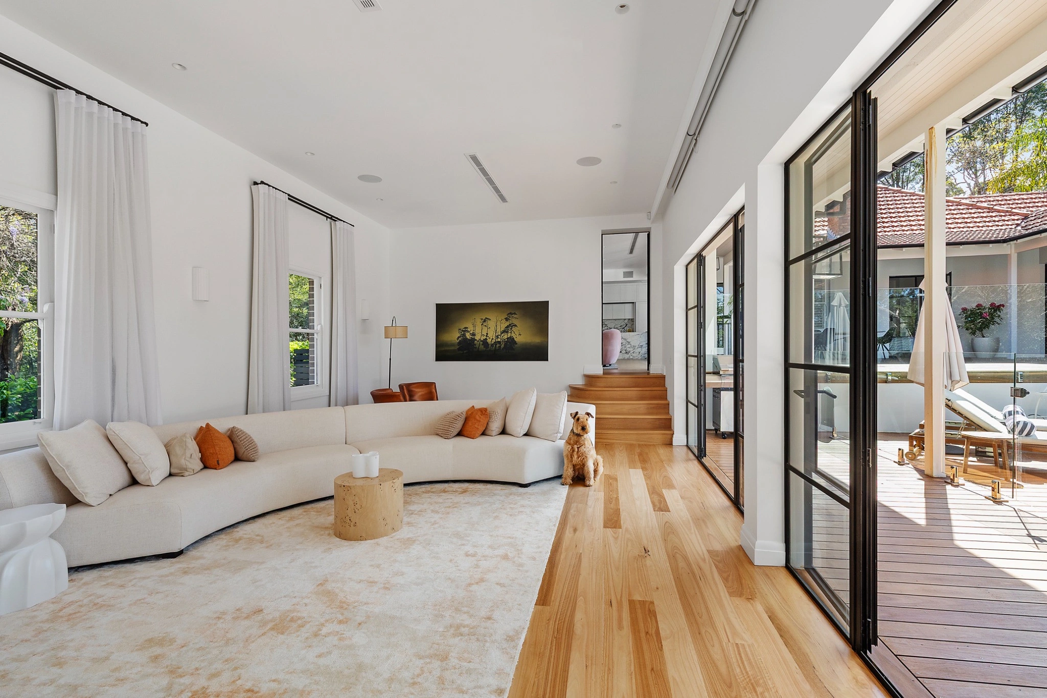 A light-filled living room opening onto a garden